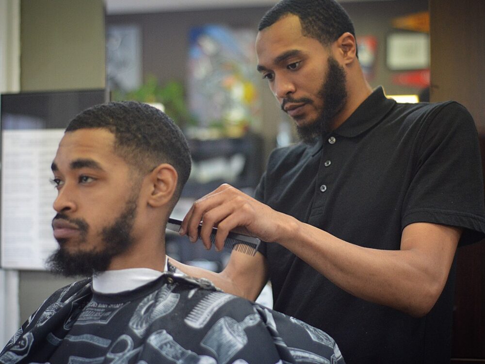 Talib T trimming a client's neckline