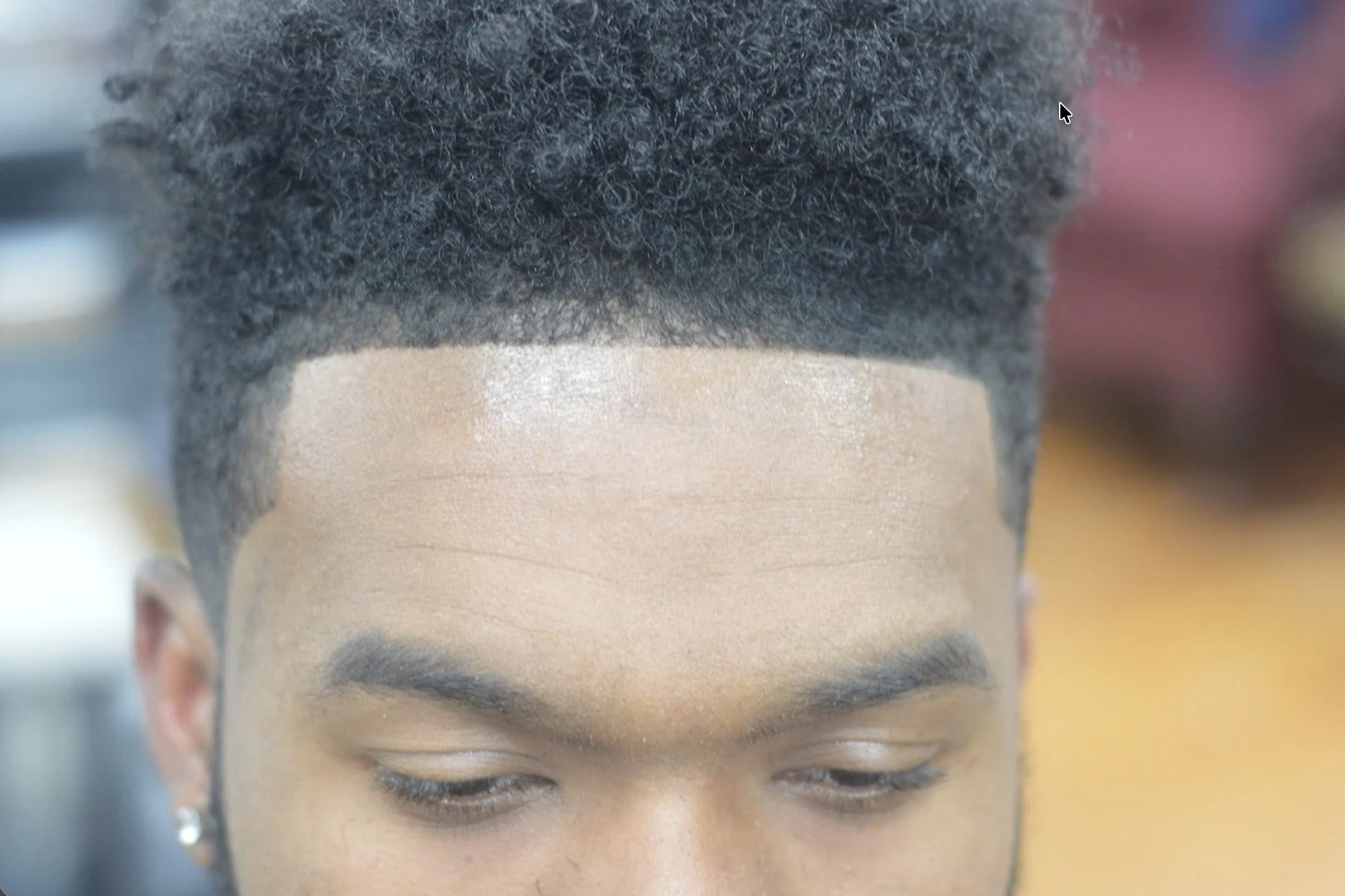 Afro taper and lineup top view on natural hair at TCUTME Laurel MD