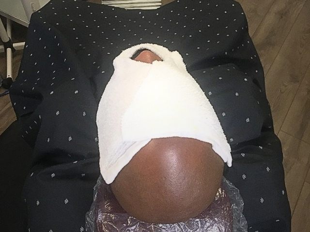 Straight razor shave in progress